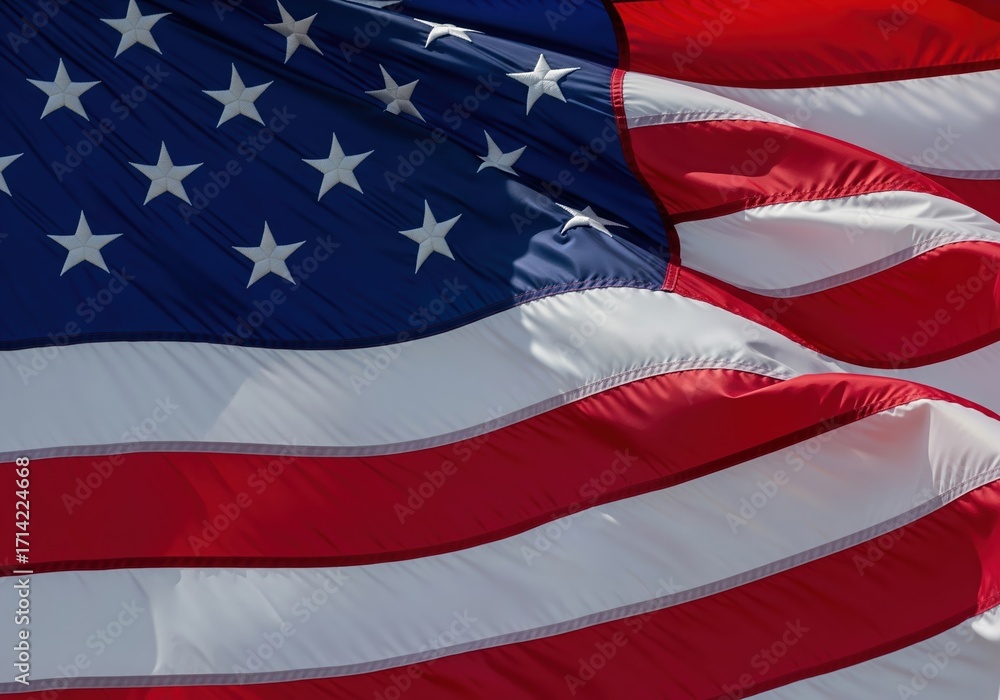 Obraz premium Close-up of the American flag waving proudly in the wind, a symbol of freedom and patriotism