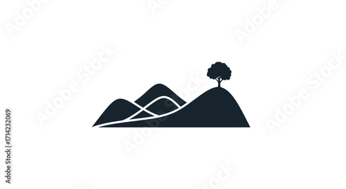 Silhouette of Mountains and a Tree on a Hill.