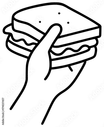 A hand holds a large sandwich in the air