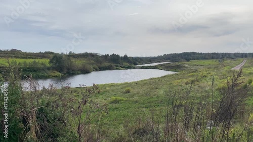 A Serene and Picturesque Riverscape Showcasing Lush Greenery and Tranquil Waters