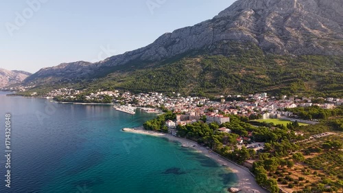 Golden hour over Makarska Riviera Croatia with terracotta rooftops pine parks and clear blue waters beneath towering Biokovo