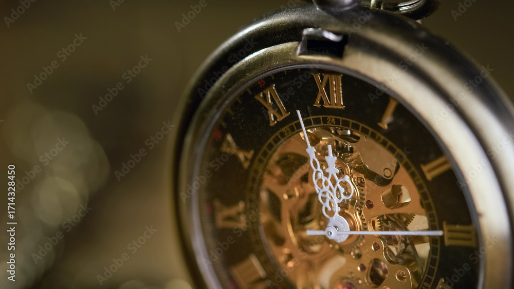 Fototapeta premium Gears, inner workings, and white hands of a golden vintage pocket watch, macro shot. Time, inspiration, and antique concepts.