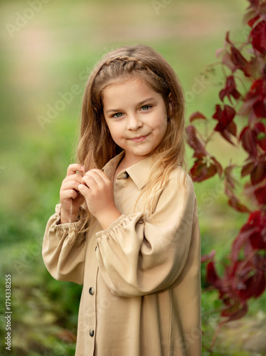 smiling girl with long hair in autumn park