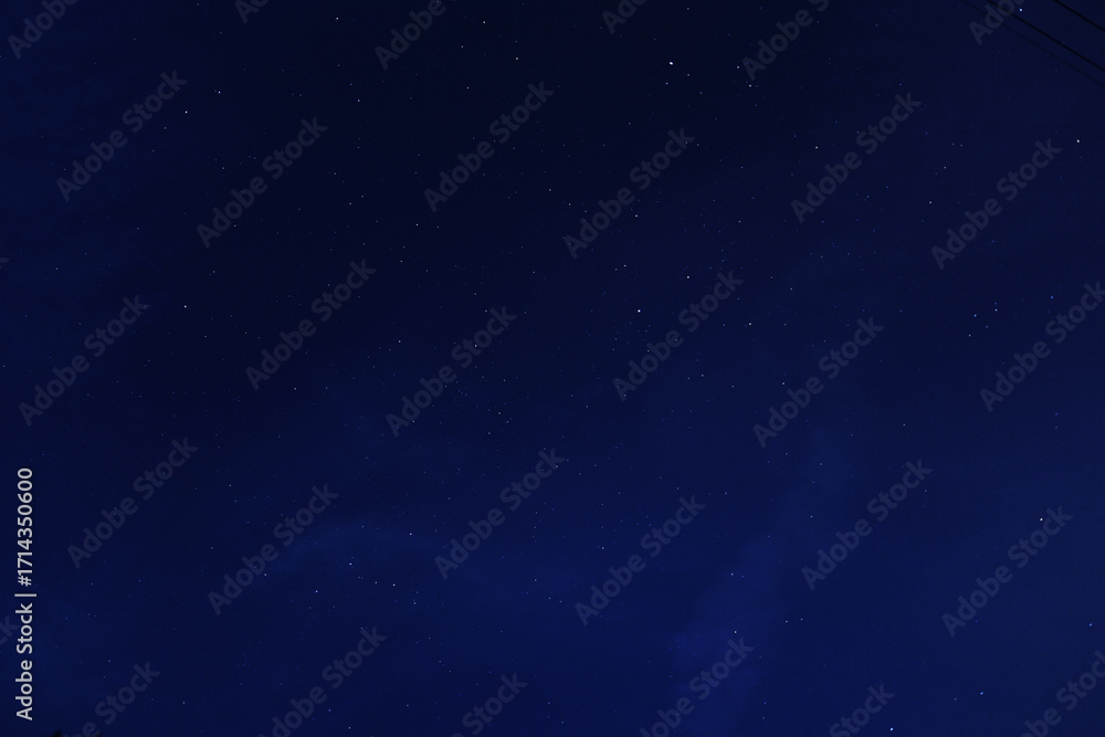 Fototapeta premium Night starry sky over autumn forest.