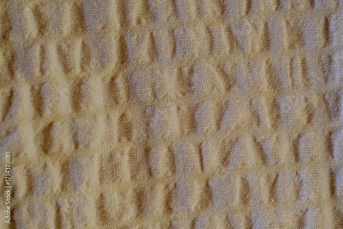 close-up of a textured beige cotton fabric