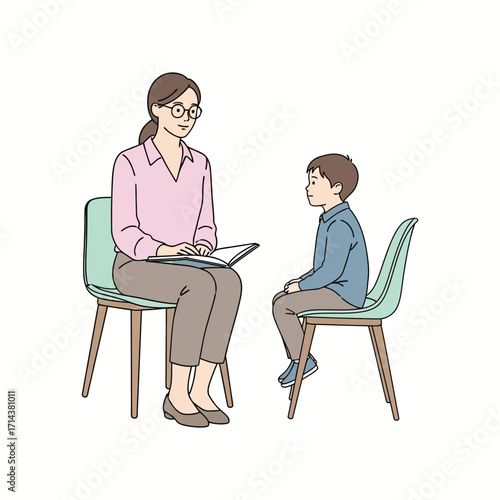 Female therapist counseling a young boy during a therapy session.