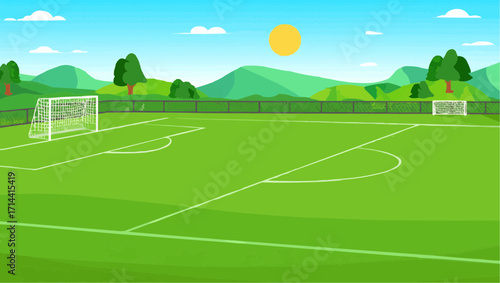 Sunny day on a lush green soccer field with mountains in the background