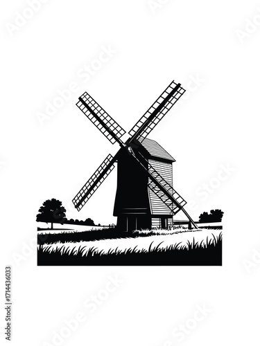 Vintage silhouette of a traditional windmill in a rural landscape