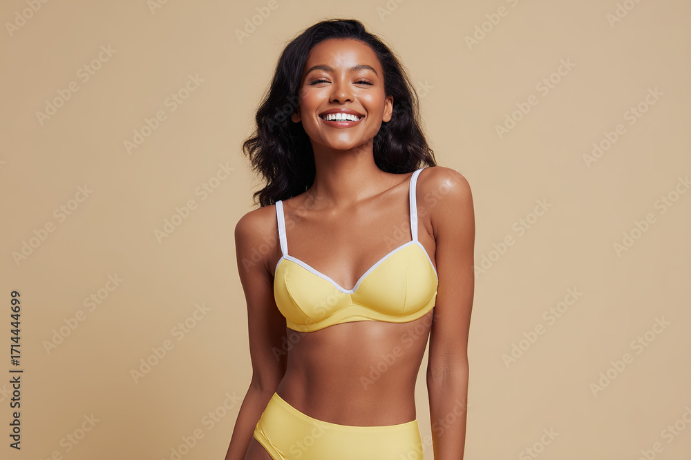 Fototapeta premium Radiant woman smiles in a yellow swimsuit. Her joy shines, creating a vibrant image against a soft backdrop. Positive energy is contagious.