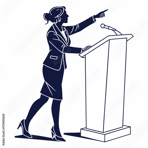 Confident businesswoman in a suit stands at a podium pointing forward with a microphone indicating leadership and public speaking engagement in a professional setting