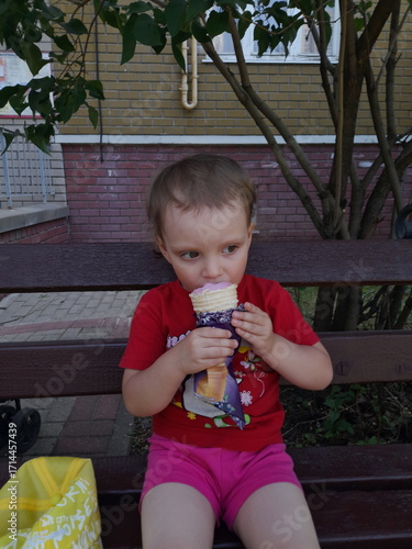 little girl eating apple