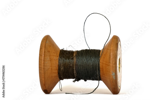 Vintage wooden thread spools rustic needlework concept