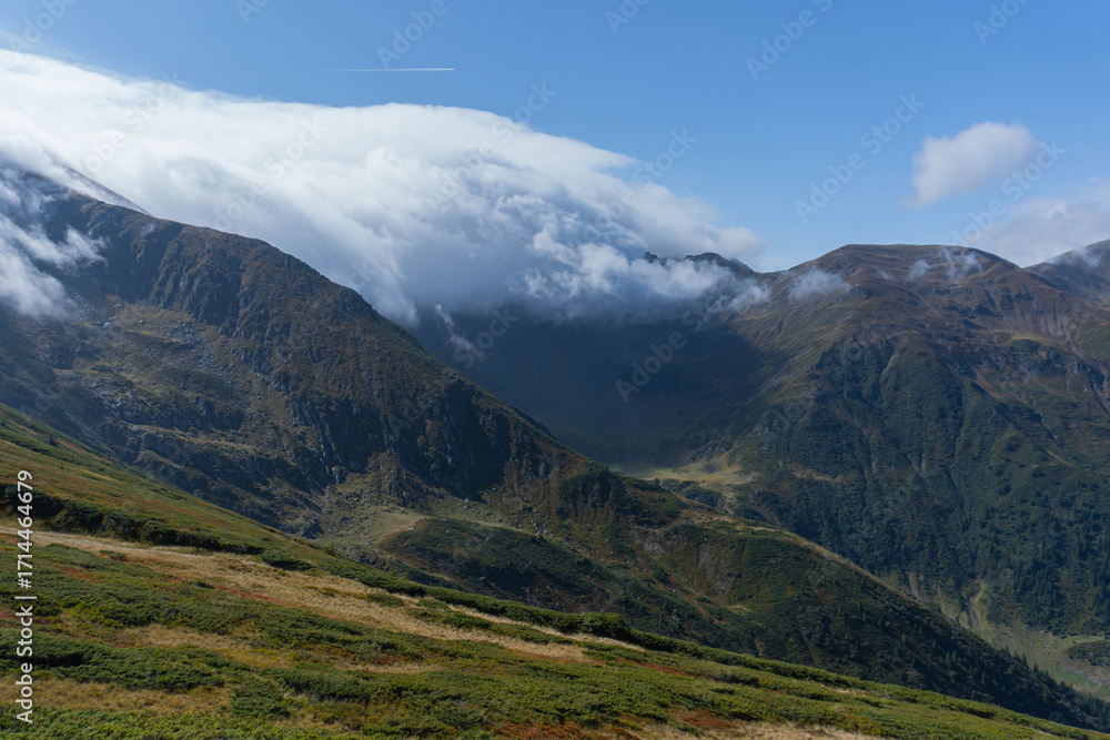 Fototapeta premium fagaras mountains ridge high mountain peaks on sunny day with big white clouds