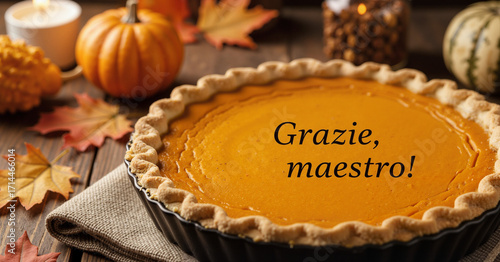Pumpkin pie with Italian teacher gratitude message surrounded by autumn decorations