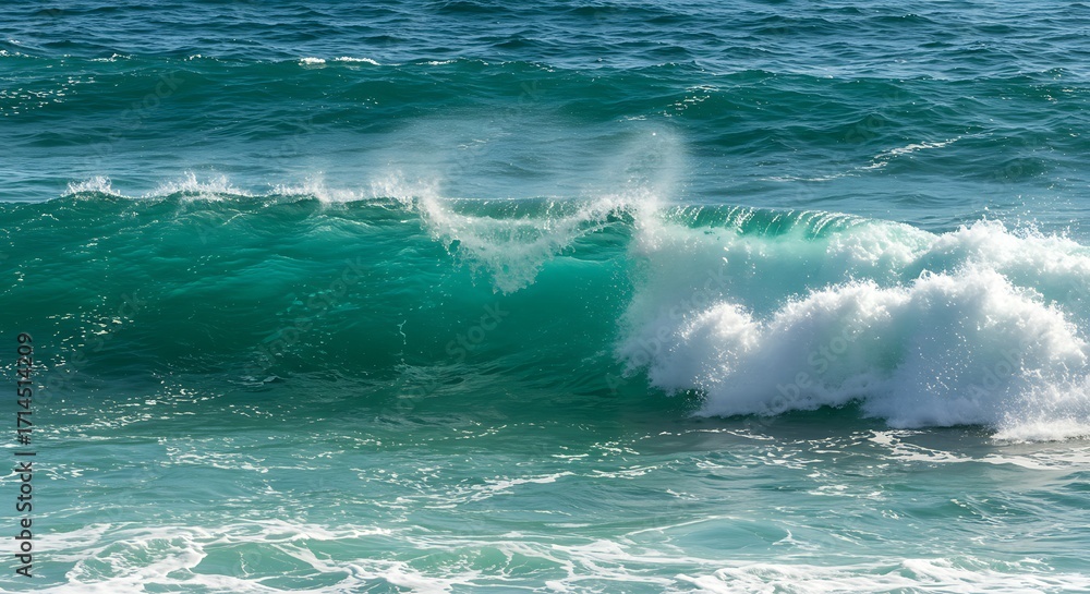 Fototapeta premium Powerful turquoise ocean wave breaking with white foam and spray