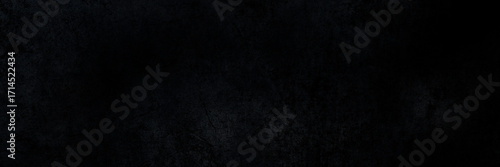 dark black grunge textured background with rough abstract surface patterns for modern graphic design