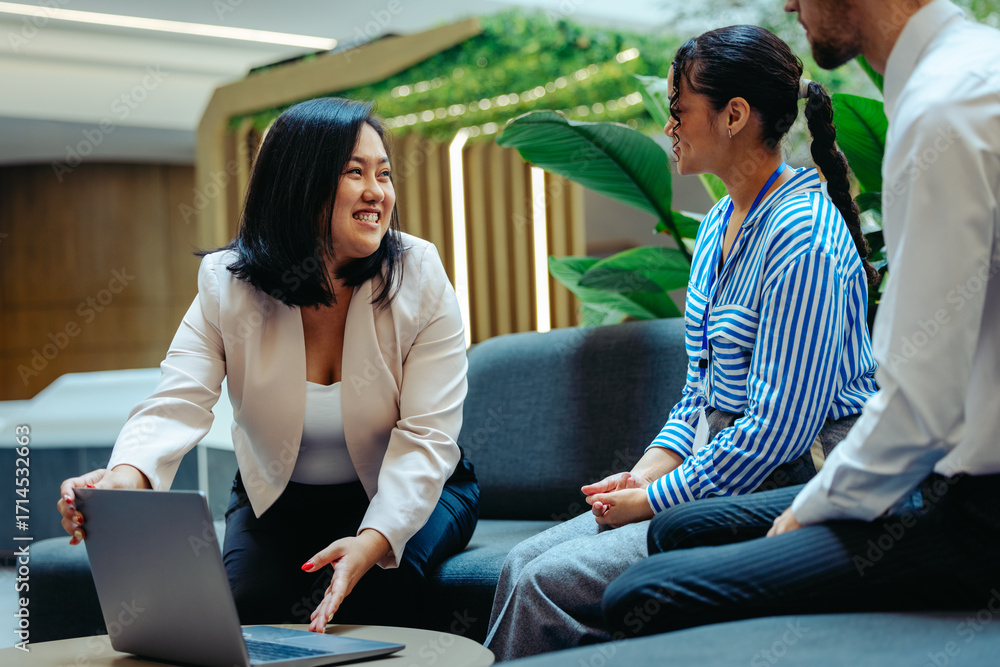 Fototapeta premium Chinese businesswoman leading a collaborative team meeting