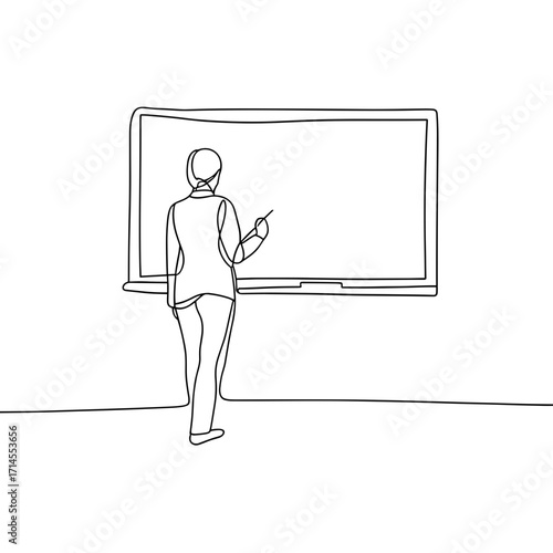 Teacher standing and pointing at blank board in classroom setting  
