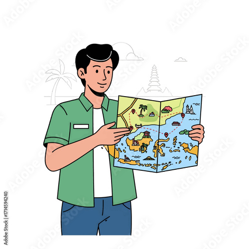 A young man in a green shirt and blue jeans is holding and pointing at a colorful map of islands, planning a trip.