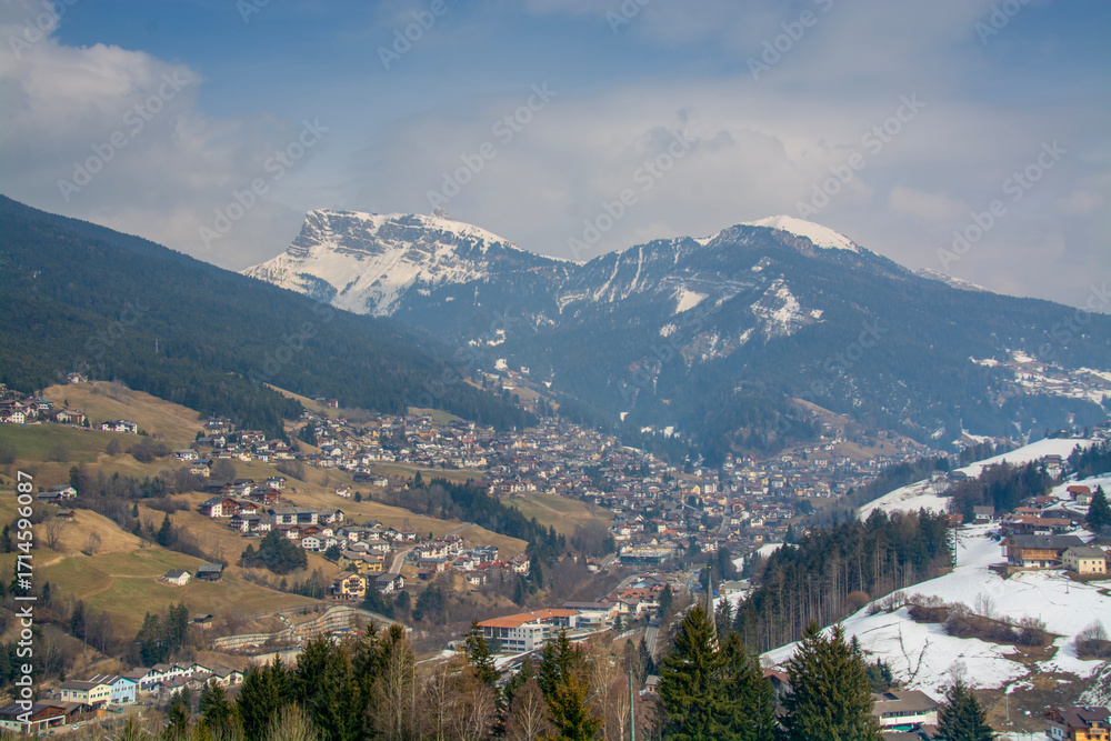 Fototapeta premium Ortisei (Urtijëi) Town in the Dolomites with Snow-Capped Mountains