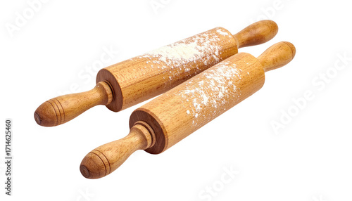 Two wooden rolling pins with flour