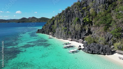 Coron, Palawa, Philippines, in South East Asia, with White Sand Beach, Turquoise Water, filmed on an Island island hopping boat tour with Limestone Cliffs in the background