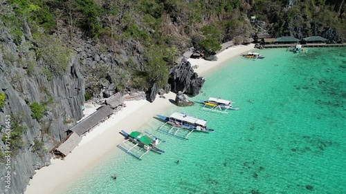 Coron, Palawa, Philippines, in South East Asia, with White Sand Beach, Turquoise Water, filmed on an Island island hopping boat tour with Limestone Cliffs in the background