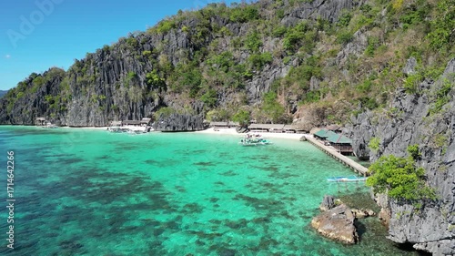 Coron, Palawa, Philippines, in South East Asia, with White Sand Beach, Turquoise Water, filmed on an Island island hopping boat tour with Limestone Cliffs in the background