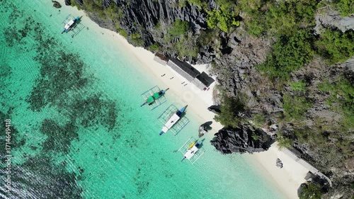 Coron, Palawa, Philippines, in South East Asia, with White Sand Beach, Turquoise Water, filmed on an Island island hopping boat tour with Limestone Cliffs in the background