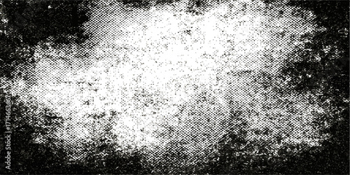 An abstract black and white grunge background with a cold, dirty, textured surface of frozen water and a paint splash