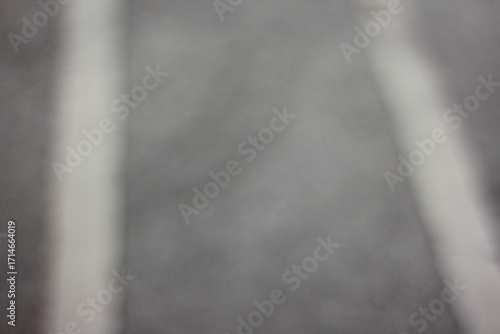 A dreamy view of road marking on asphalt.