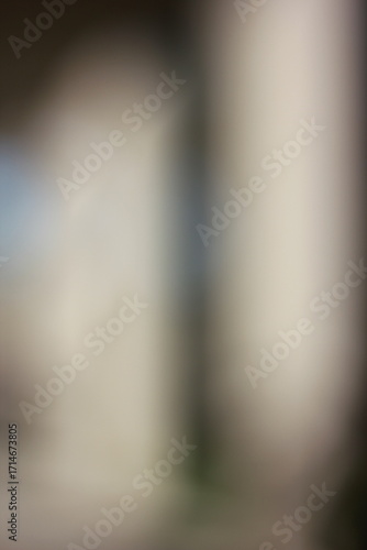 A dreamy view of a modern column on a building with room for text.