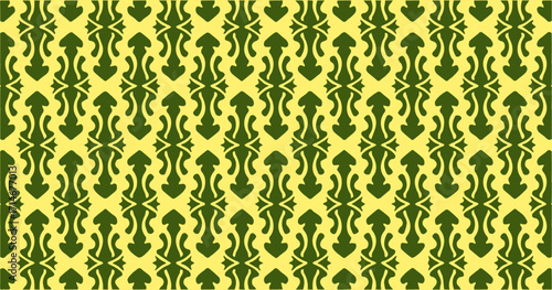 Yellow and dark green ornate seamless pattern with intricate curves for stylish textiles or wallpaper.