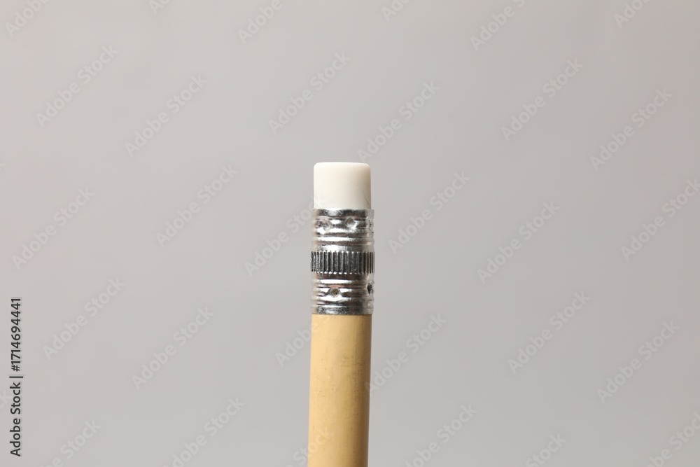 Obraz premium One graphite pencil on grey background, closeup