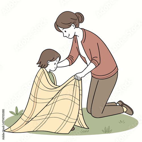 Caring mother tucks a child in a warm blanket on the grass showing love and protection