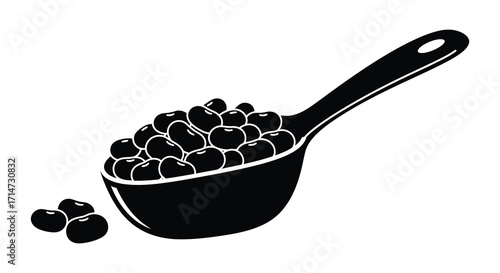 A black measuring spoon filled with cherries and a few loose