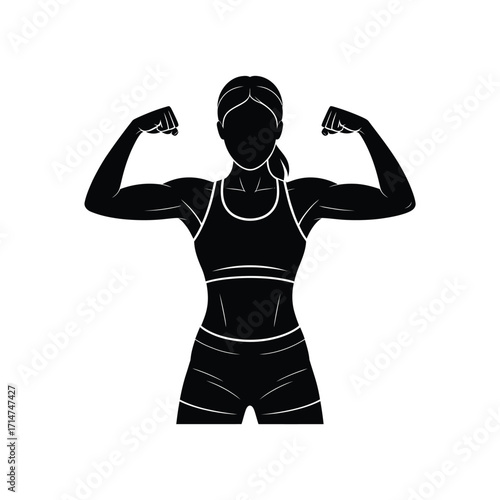 Silhouette of a strong woman flexing her biceps in a sports bra and shorts