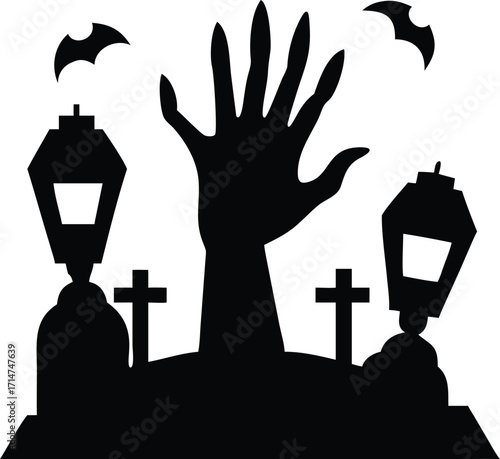 Silhouette of a zombie hand rising from a graveyard on halloween