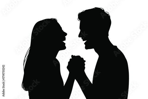 Silhouette of a happy couple holding hands and laughing together