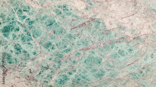 Beautiful close up shot of turquoise green marble with intricate webbed veining pattern suitable for upscale designs and elegant backgrounds.