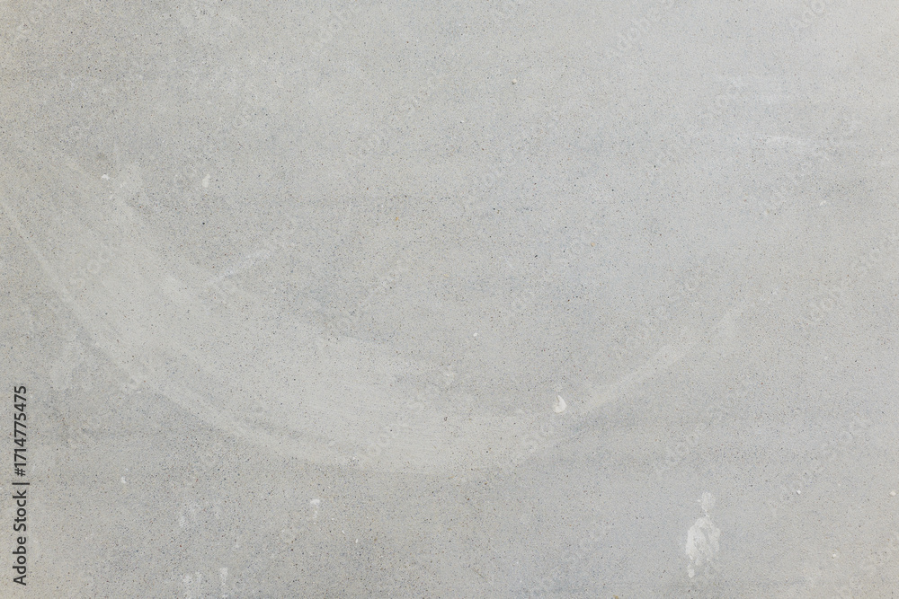 Obraz premium Smooth gray concrete surface with subtle textures and marks on it