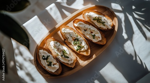 Delicious Bread With Creamy Topping Garnished With Herbs on a Wooden Platter ...