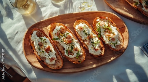 Delicious Bread With Creamy Topping Garnished With Herbs on a Wooden Platter ...