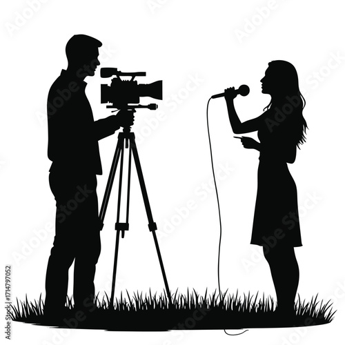 Silhouette of man operating video camera and woman holding microphone