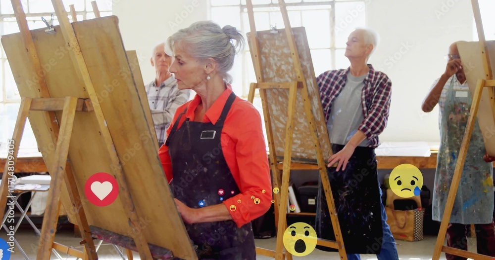 Naklejka premium Painting mature woman in red-orange blouse at art studio with wooden easels and social media icons