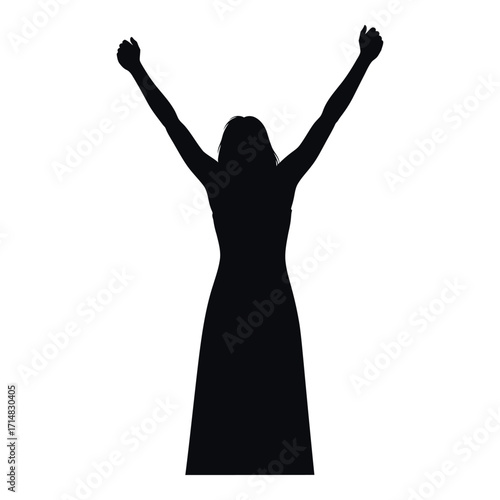 A jubilant woman with arms raised in a dark silhouette