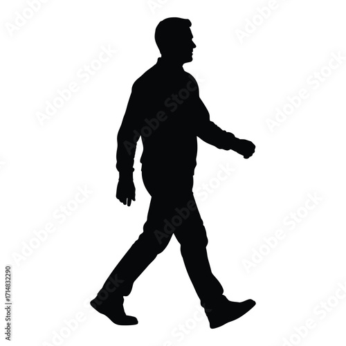 A man walking forward captured in a striking black silhouette