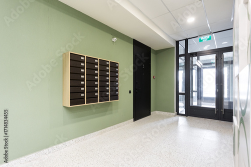 mailboxes in the lobby of an apartment building