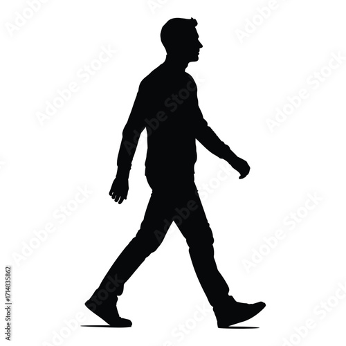 A man walking forward captured in a striking black silhouette