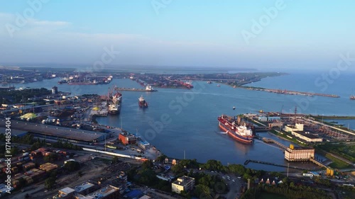 Indian sea port captured by drone at sunset.  Oil ship tanker in Worldwide shipping and logistics business. Paradeep Port for Indian Transport.
